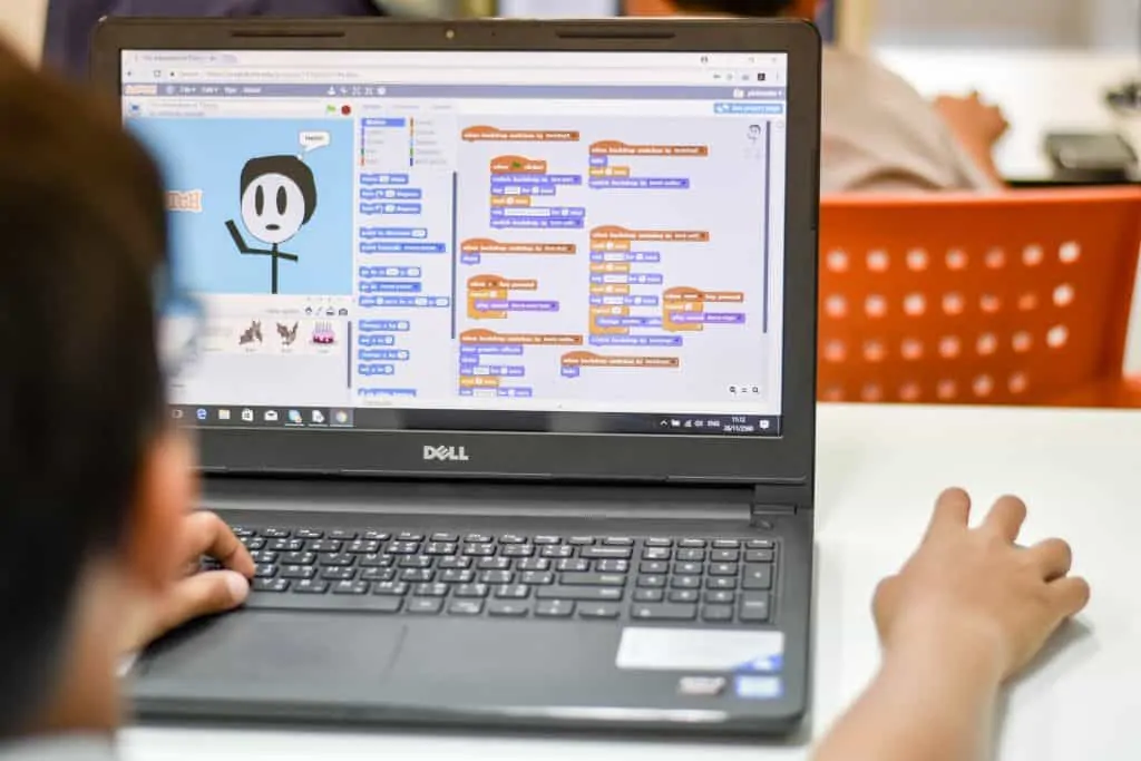 a kid using Scratch