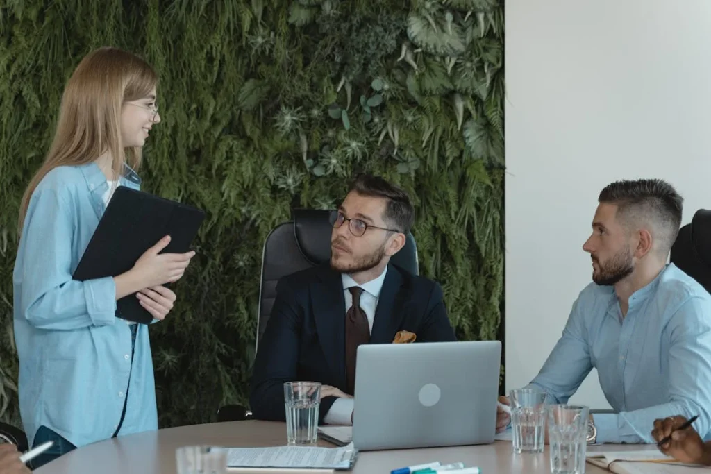 three people having conversation